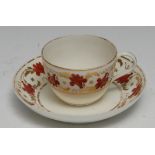 A Pinxton Bue shaped teacup and saucer, pattern no. 312, decorated in red and gilt with bands of