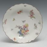 A Chelsea shaped circular dish, painted with flower spray and sprigs, 20cm diam, red anchor mark,