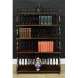 A Regency design open waterfall bookcase, turned spindle and scroll supports, rook-form feet, 124.