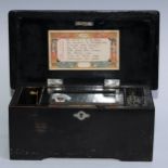 A late 19th century ebonised and mother of pearl music box, 9cm cylinder playing eight airs on a