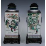 A pair of Chinese square vases, painted in polychrome in the famille verte and rose palette with