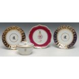 An early 19th century Chamberlain Worcester shaped plate, centre with crest and initial P, claret