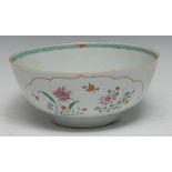 An 18th century Chinese Famille Verte bowl, painted with stylised flowers and foliage, 20cm diam,