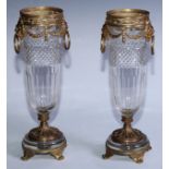 A pair of French gilt metal and cut glass mantel vases, collars cast and pierced with a band of