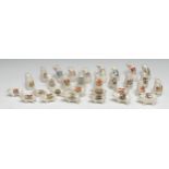 Eleven crested ware pigs, standing, each with town crest in polychrome, various markers; others,