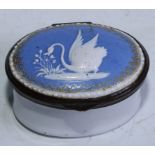 A George III South Staffordshire enamel oval patch box, hinged cover decorated in raised opaque with
