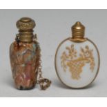 A Rococo Revival gilt-metal mounted opaque glass oval scent bottle, gilt with foliage and trellis,