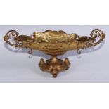 A 19th century French ormolu navette shaped pierced two handled pedestal table centre, decorated