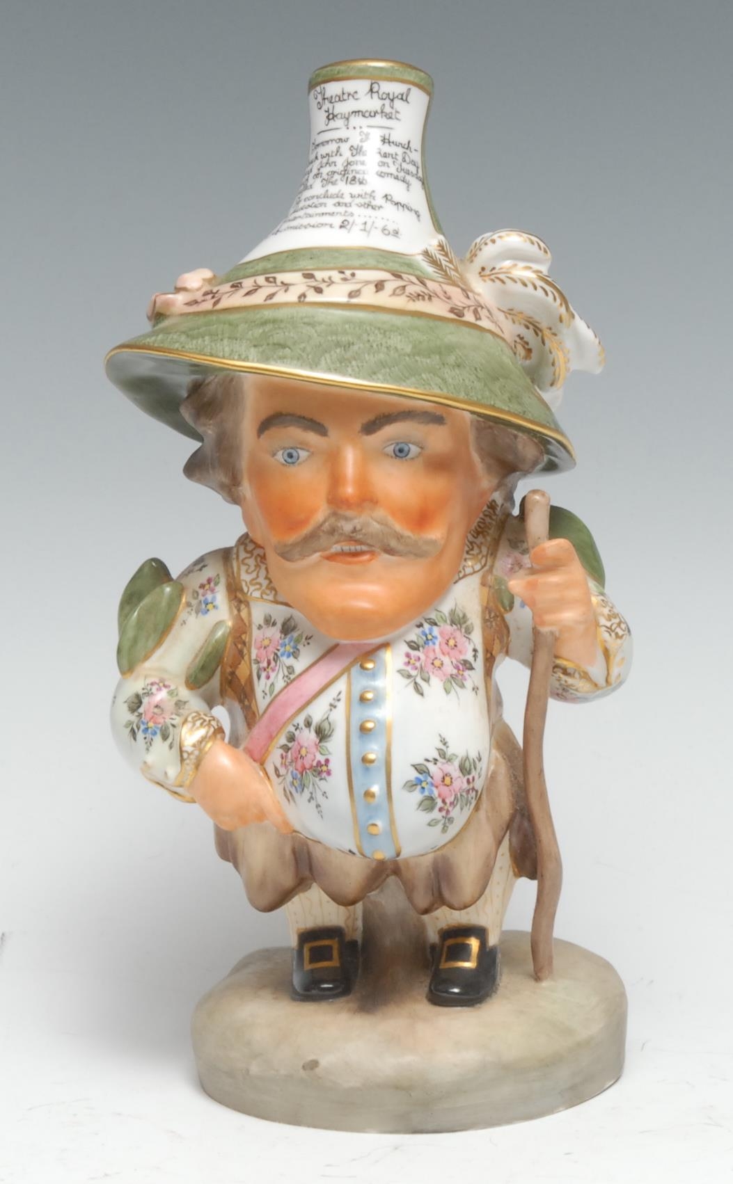 A Royal Crown Derby Mansion House dwarf, richly attired in 17th century cavalier costume,