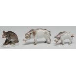 A Meissen model, of a wild boar, seated, shaped oval base, 5.5cm high, crossed swords, impressed