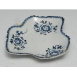 A Liverpool leaf shaped pickle dish, painted with three trailing flowers, the underside in relief,