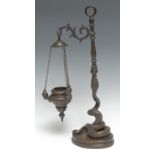 A 19th century Grand Tour brown-patinated bronze lamp and stand, cast in the manner of the