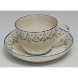 A Pinxton Bute teacup and saucer, pattern No. 9, decorated with grey swags with green and yellow