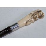 A Japanese novelty ivory walking stick handle, carved with a monkey and a turtle, the silver-mounted