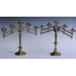 A pair of Victorian Gothic Revival brass adjustable five-light table candelabra, each branch with