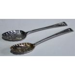 A George III silver berry spoon, embossed bowl, engraved floral handle, Thomas Wallis I, London