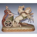 A large Royal Dux group of a Roman charioteer and team of two racing, typical blush ivory tones,