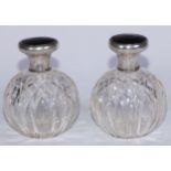 A pair of American silver, tortoiseshell and pique mounted cut-glass globular scent bottles, push-