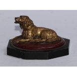 A 19th century novelty gilt-patinated and specimen marble inkwell, as a recumbent dog, its head
