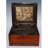 A late 19th century table-top polyphon, playing a 24cm diameter disc, the bedplate numbered 20976,