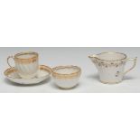 A Derby coffee cup, tea bowl and saucer, spiral leafy moulded, salmon and gilt border, crown,