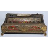 A 19th century French ormolu and Boulle standish with covered wells and dished trays within bowed