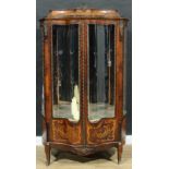 A 19th century French gilt metal mounted rosewood and marquetry shaped serpentine vitrine, of