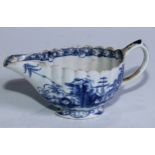 A Bow Desirable Residence pattern fluted butter boat, painted in tones of underglaze blue, scroll