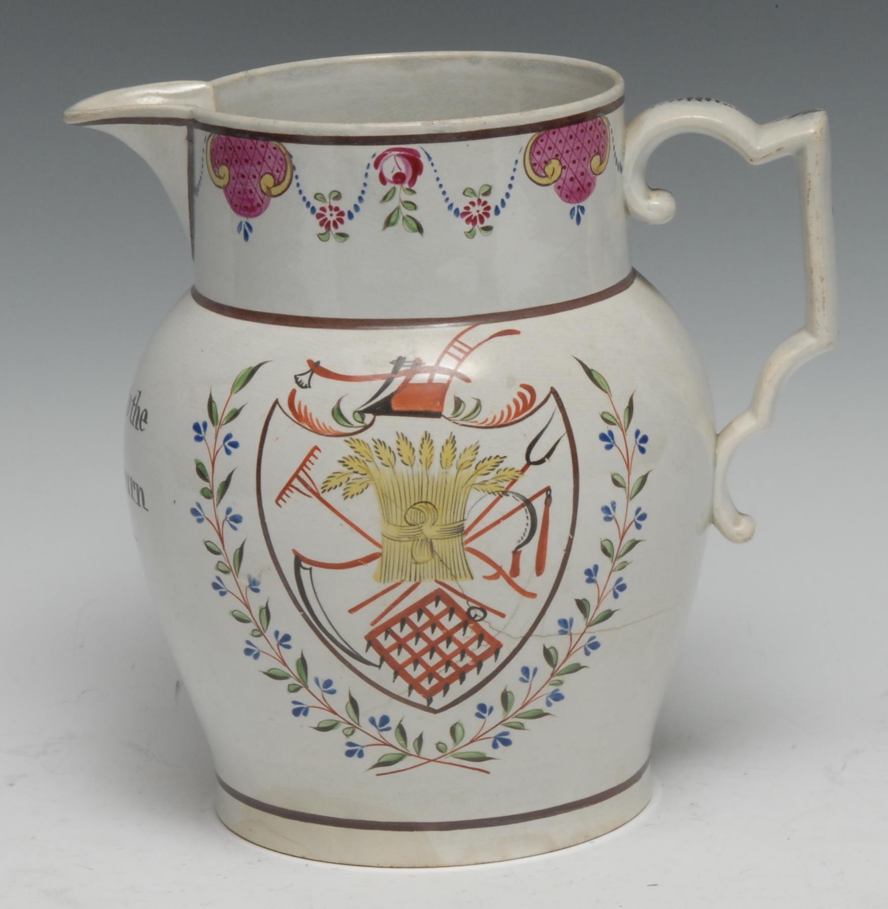 An early 20th century Pearlware jug, Success to the Grain Return, painted with a shield with farming