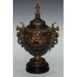 A 19th century parcel-gilt spelter urn and cover, cast in the Renaissance manner, sphinx finial,