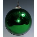 A late 19th/early 20th century iridescent green glass witches ball, metal hanging pendant, 19cm diam