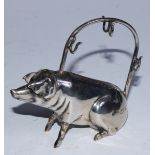 A George V silver novelty manicure stand, as a seated pig, 7cm high, London 1913