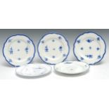 Five Caughley shaped circular plates, each decorated in underglaze blue with floral