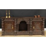 An 18th century oak low 'dog kennel' dresser, shaped rectangular top with inverted gadrooned edge,
