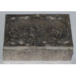 A Continental silver rectangular box, chased with revellers outside an inn, hinged cover, 12cm wide,