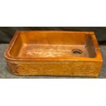 A 19th century Derbyshire salt glazed stoneware rounded rectangular sink, incised and in relief with