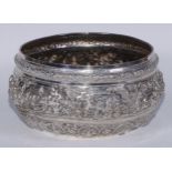 A Burmese silver circular bowl, profusely chased with figures, 23.5cm diam, c.1880, 1134g