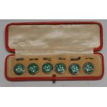 A set of six Art Nouveau silver and green enamel buttons, each decorated with a four-leaf clover and