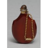 A 19th century carnelian scent or snuff bottle, of tear-drop shape, 6.5cm long
