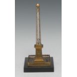 A 19th century Grand Tour gilt-bronze desk thermometer, cast as Cleopatra's Needle, black marble