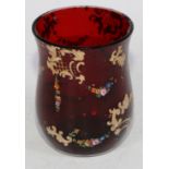 A 19th century ruby glass beaker, decorated in polychrome enamels and gilt with flowering swags,