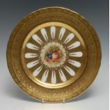 An Aynsley circular plate, painted with D Jones, signed, with fruit, on an elaborated acid etched