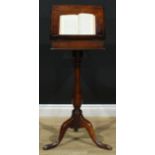 A 19th century mahogany reading table, the associated top with hinged cover adjustable on a ratchet,