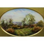 A Royal Worcester oval plaque painted by Raymond Rushton, signed, with rabbits grazing in blooming