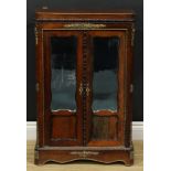 A 19th century French gilt-metal mounted rosewood vitrine or cabinet, of small proportions, canted