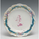 A Derby shaped circular dessert dish, painted by Richard Askew, in puce camieau with cherub on a