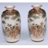 A pair of Japanese ovoid Satsuma vases painted with figures in gardens under a bamboo canopy,