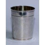 A 17th century German silver cylindrical beaker, slightly flared rim, snakeskin textured surface,