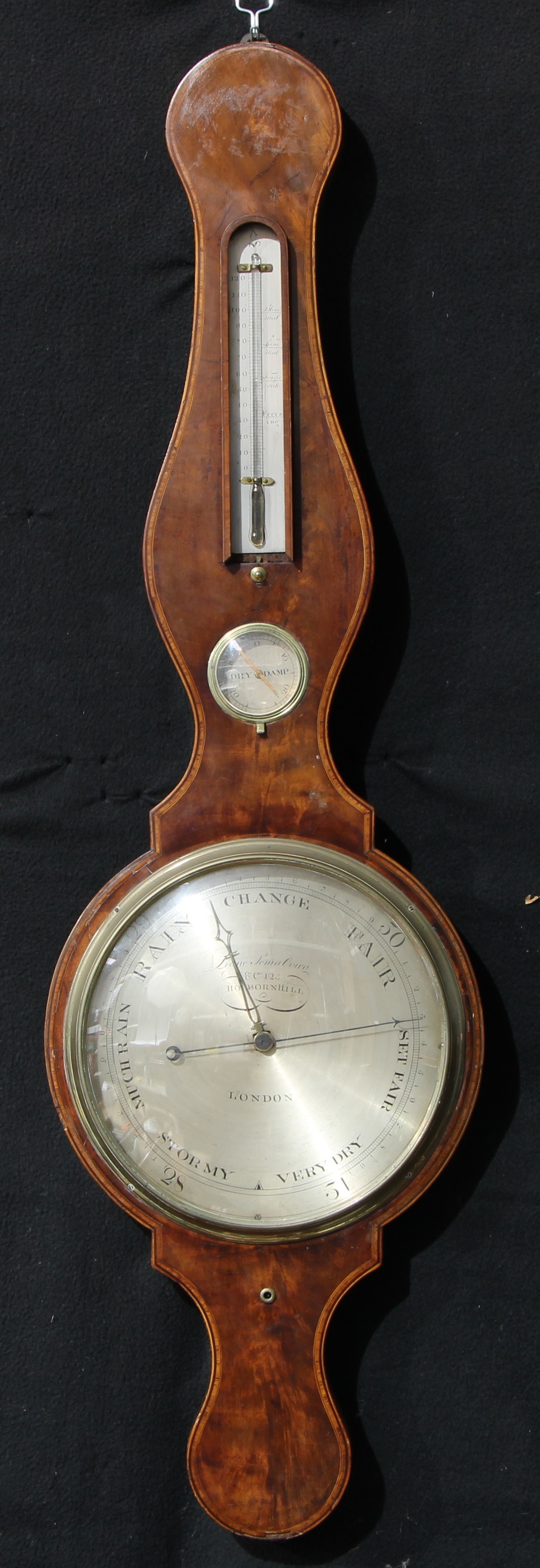 A George III mahogany wheel barometer, 25cm silvered register inscribed Lione Somalvico & Co, 125
