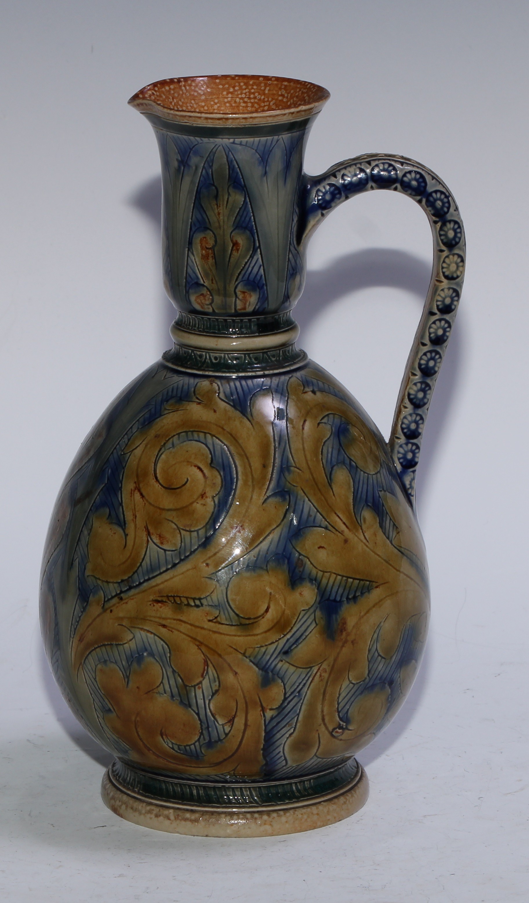 A Doulton Lambeth earthenware ovoid ewer, by Arthur B Barlow and Emma Martin, incised with stiff and